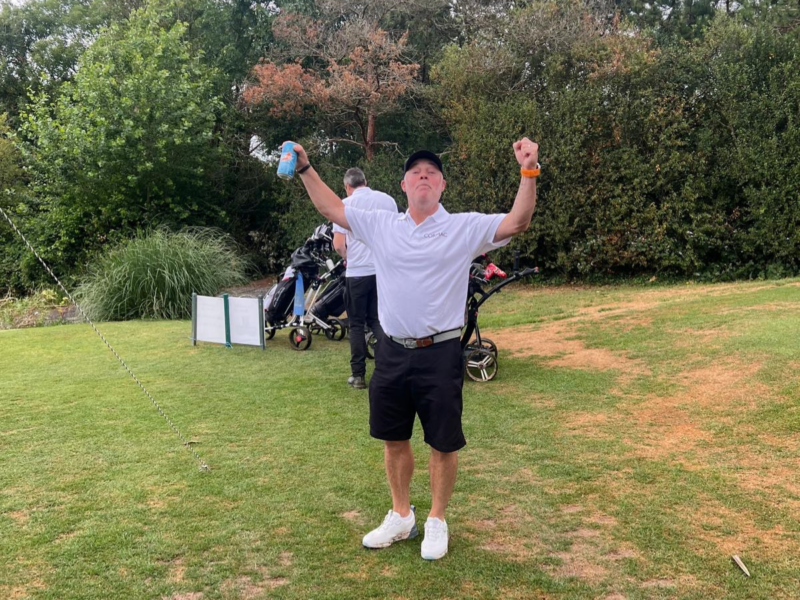 Cormac worker playing golf