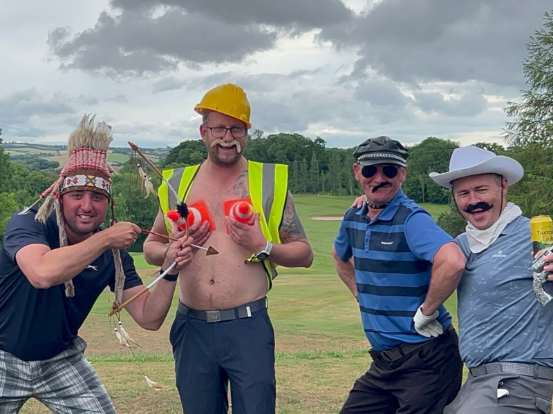 Group of four in dressup for fairway