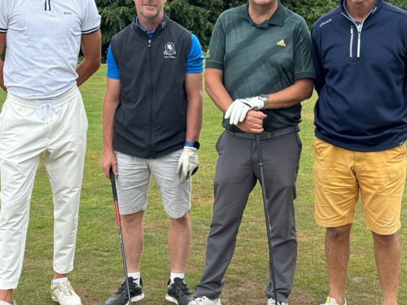 Group of four with clubs ready to play some golf