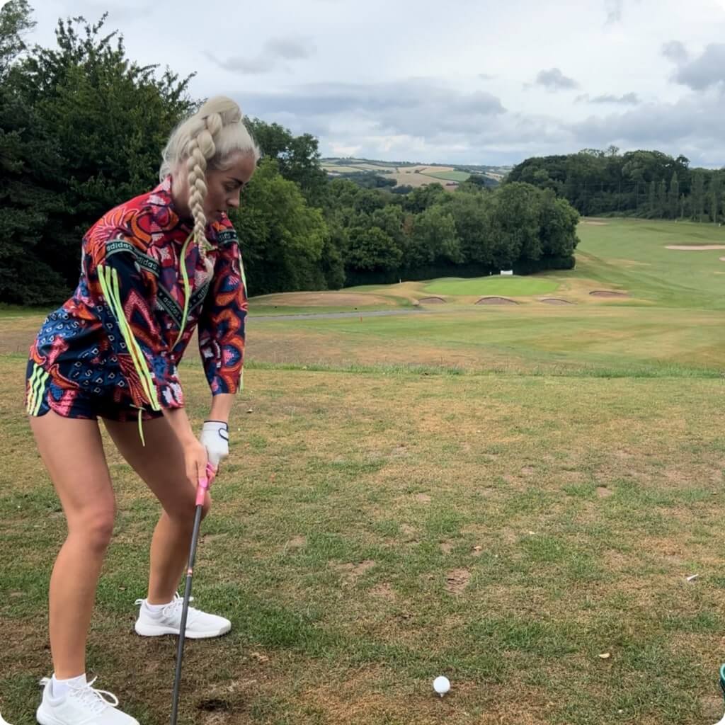 Hannah Bowen hitting golf ball