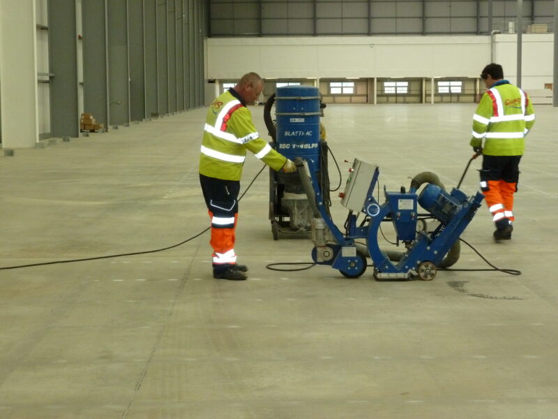 QMS preparing warehouse surface ready for line marking