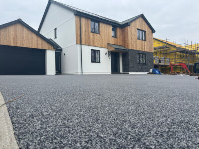 Modern residential driveway with black resin bound surfacing