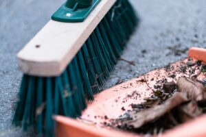 Dustpan and brush on resin driveway