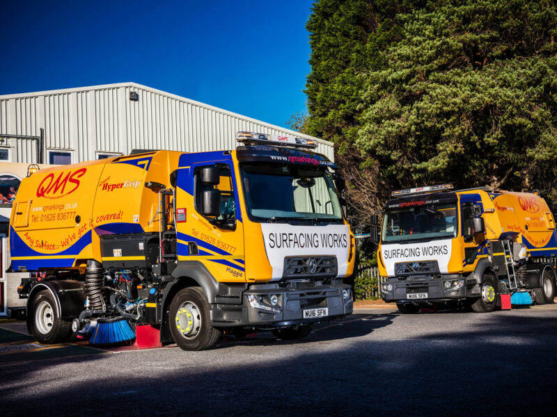 QMS Road surfacing lorries with QMS branding