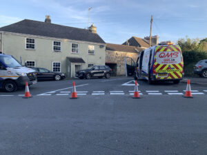 TM and Van on rural junction in Devon