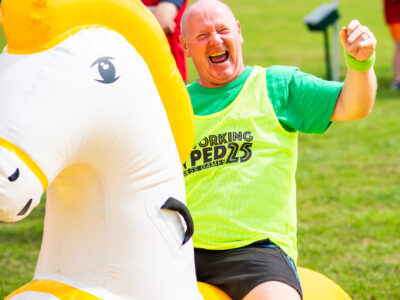 Networking Hyped 2025 Games - Man on Inflatable Horse