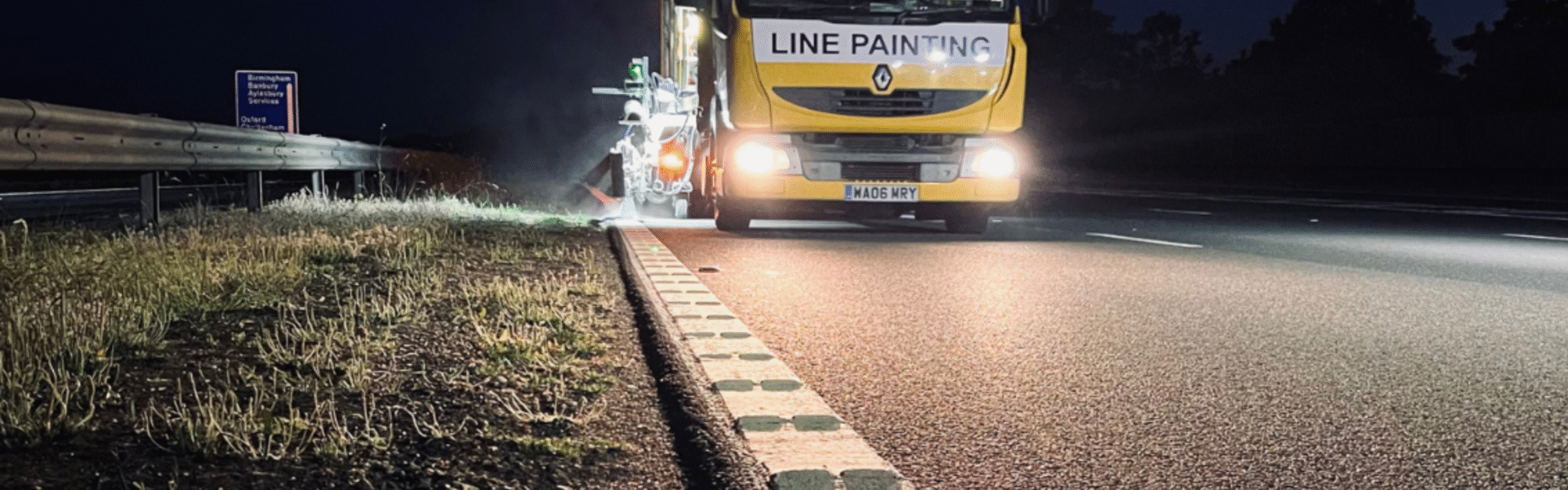 Line painting side of road truck