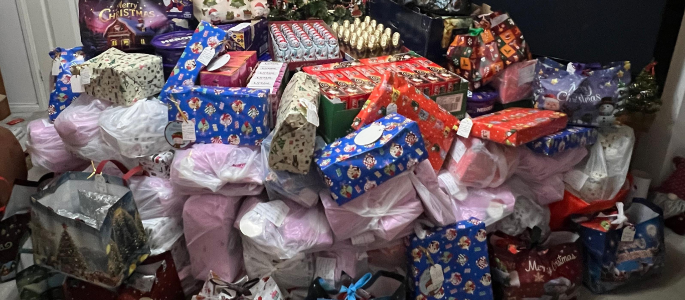 Christmas tree filled with gifts and food for Torbay PATH Charity