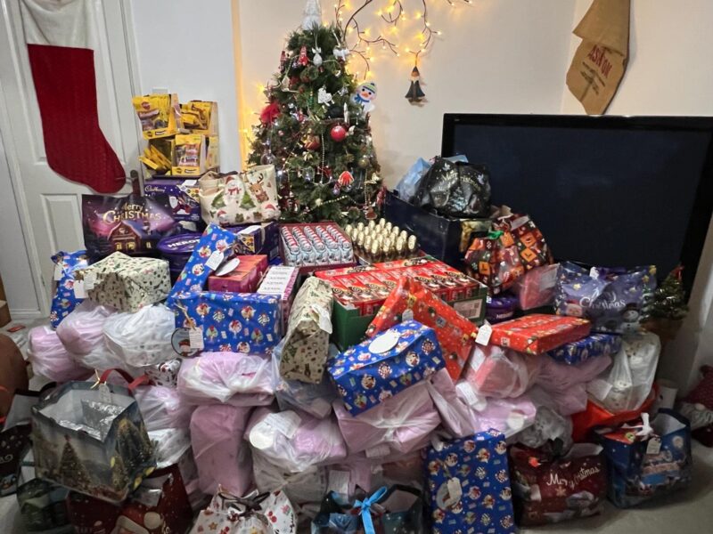 Christmas tree filled with gifts and food for Torbay PATH Charity