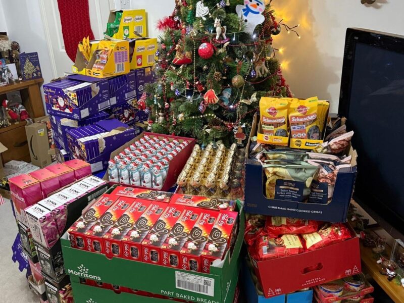 Christmas tree filled with gifts and food for Torbay PATH Charity