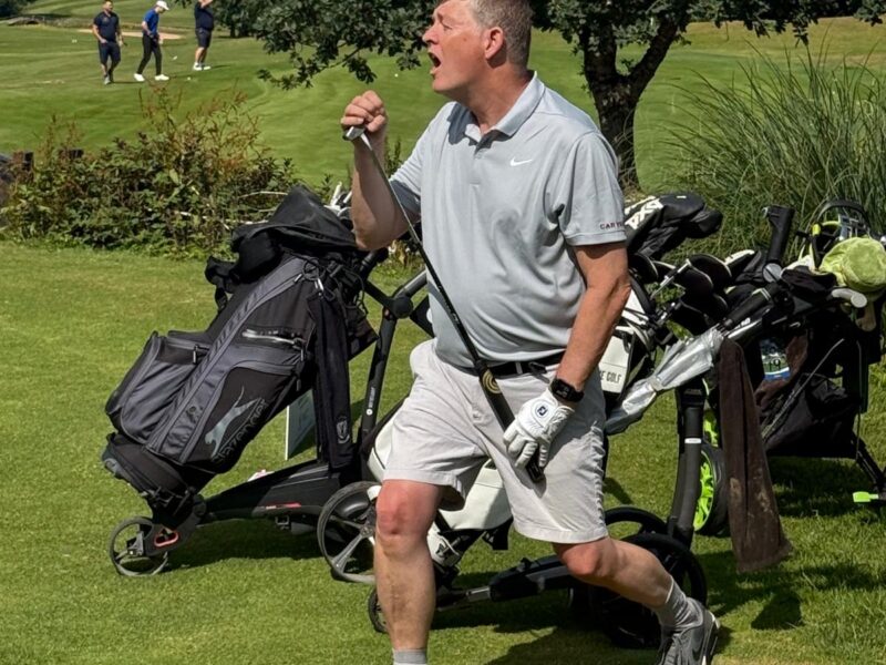 Playing golf at fairway to devon