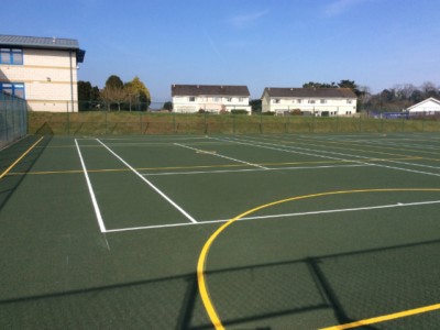 tennis and netball line markings green white and yellow