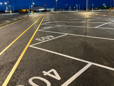 numbered car park lines with yellow pedestrian
