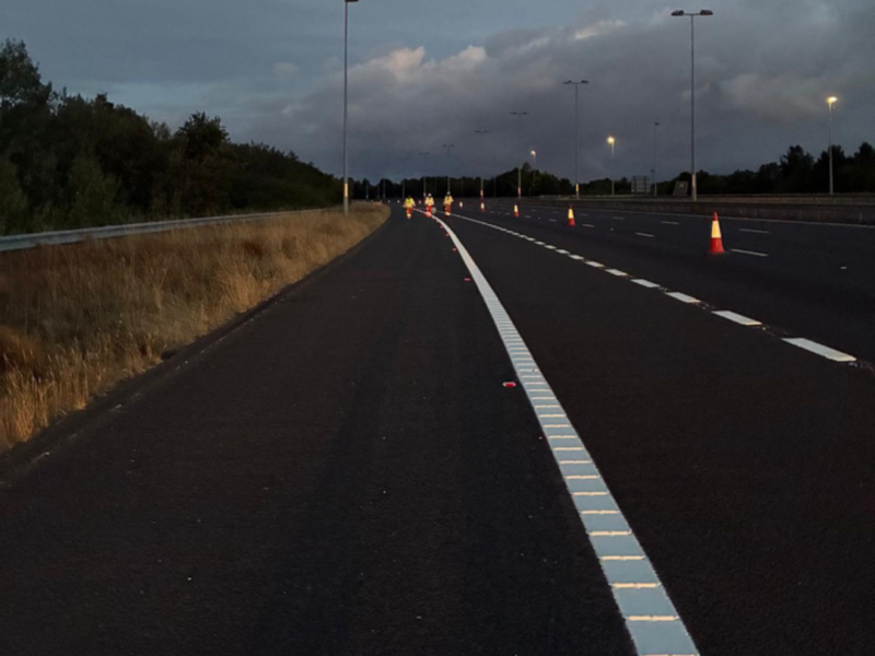 M6 Toll Line marking Edge Line with QMS Staff walking towards