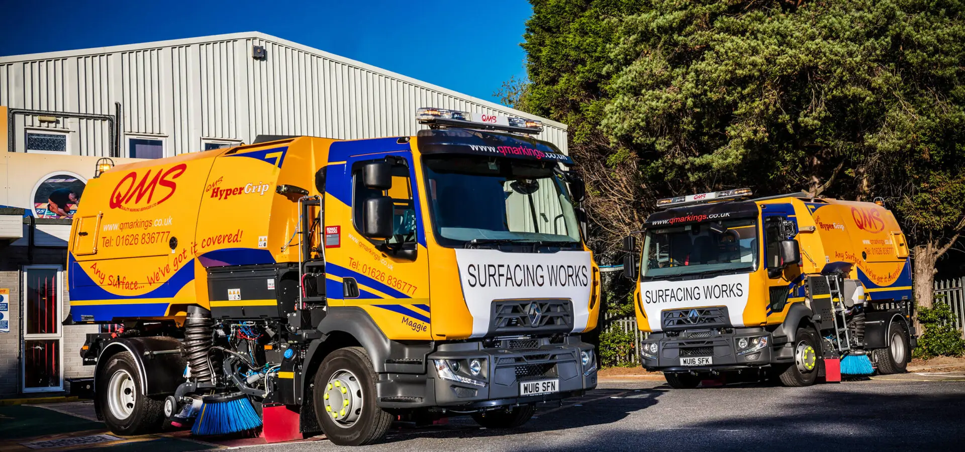 QMS Road surfacing lorries with QMS branding