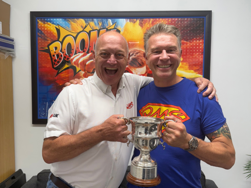 Dean (left) Greg (right) stood in QMS Cofee Lounge with Locan Cup Winner