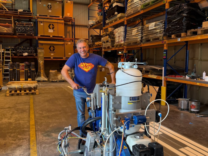 Greg Clark in Warehouse with new 982 Machine